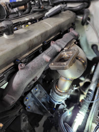 1994-2001 Skyline RB25 DE & DET Remote Top Mount (Hot Parts Kit) installation view showing turbo manifold and downpipe.