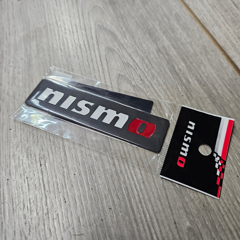 Load image into Gallery viewer, Nissan New Nismo Logo Black Emblem - NizmoPartsPlug
