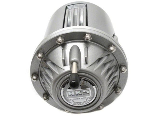Silver HKS SSQV4 universal blow-off valve, featuring a circular metallic design with logo.
