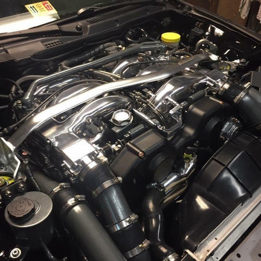 ZSPEC stainless fastener kit installed on a clean Nissan 300ZX Z32 engine bay featuring polished components.