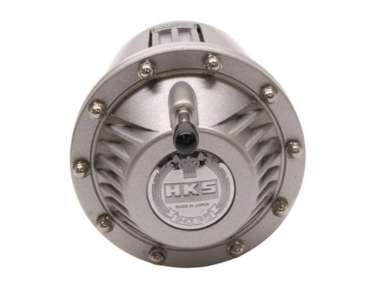 New silver HKS SSQV blow-off valve, universal fitment for various JDM turbo engines, isolated against white background.