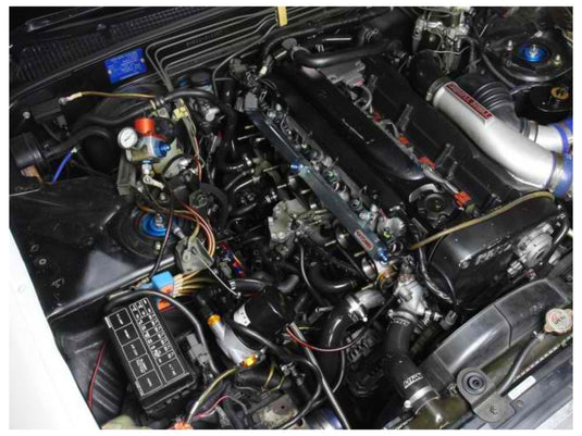 HPS black silicone radiator and heater hose kit installed in a Nissan Skyline R32 GT-R RB26 engine bay.