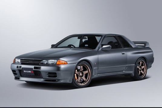 Bronze Nismo Omori Factory Rays LMGT4 18-inch wheels on a grey Nissan Skyline GT-R R32.