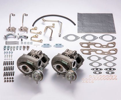 HKS GTIII 2530 SPORTS TURBINE KIT RB26 components including turbines, pipes, and gaskets for turbo upgrade.