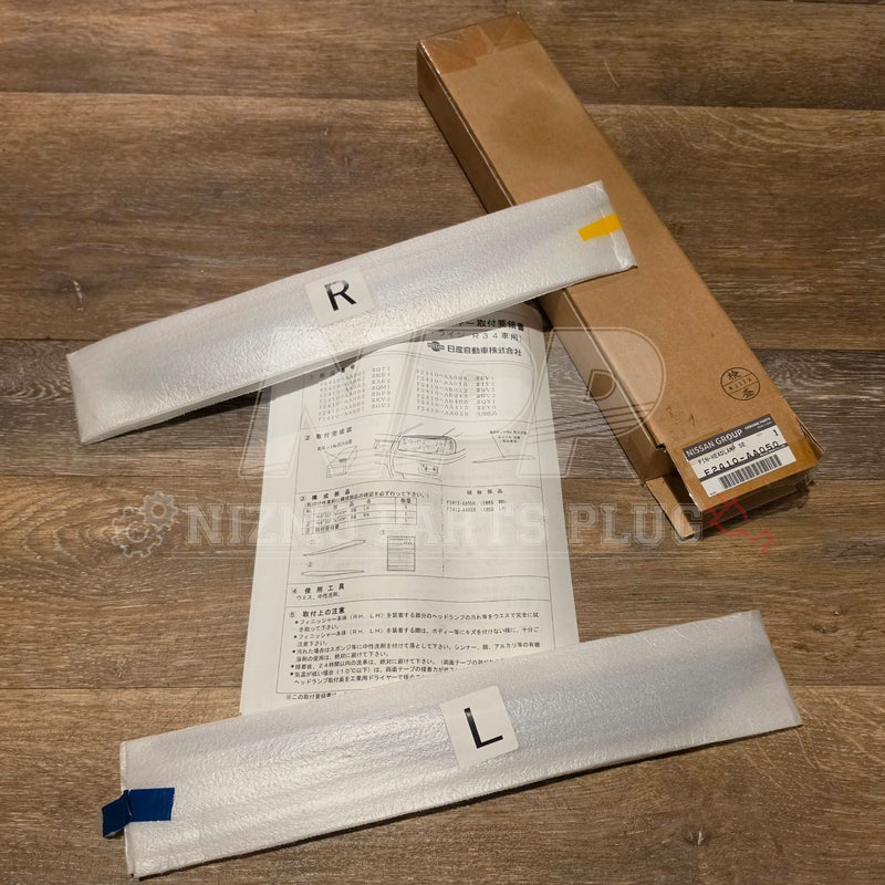Load image into Gallery viewer, Nissan Skyline R34 Optional NISMO Headlight Eyelids Kit – F2410-AA050

