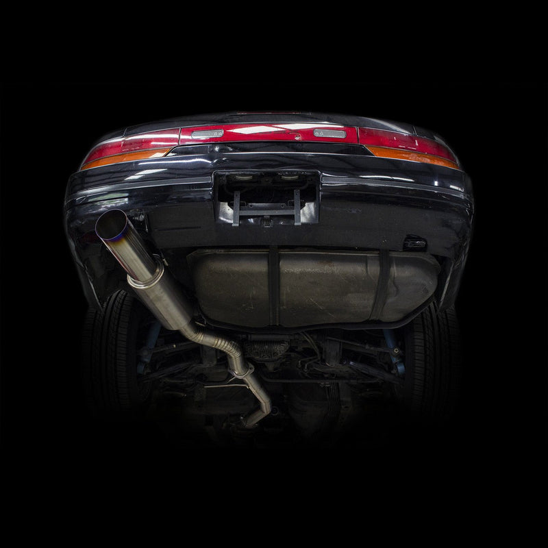Load image into Gallery viewer, ISR Titanium single exhaust installed on the underside of a Nissan 240sx S13 with a blue-burnt tip.
