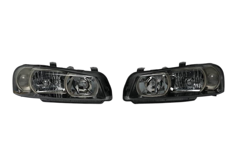 Load image into Gallery viewer, SPDZ1 Nissan Skyline R34 GTR Style OEM Replacement Headlights (Pair)
