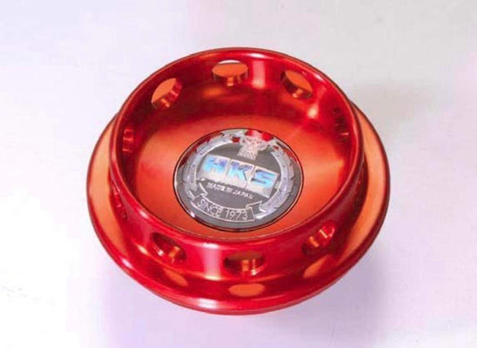 HKS Oil Cap in vibrant red color, designed for Nissan and Honda vehicles, showcasing its unique design.