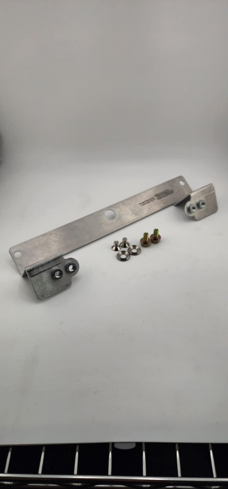Load image into Gallery viewer, R32/33 Skyline Front Bumper Conversion License Plate Mounting Bracket - NizmoPartsPlug
