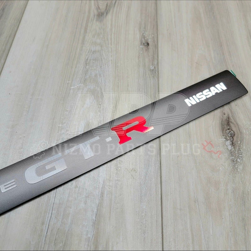 Load image into Gallery viewer, Nissan R34 Skyline GTR NÜR Center Valley Cover Emblem (RARE)
