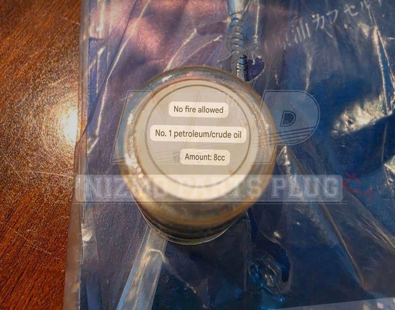 Load image into Gallery viewer, Vintage 70s Showa-Era Nissan Prince "Crude Oil Capsule" Promotional Keychain (UAE / Resource Conservation) - NizmoPartsPlug
