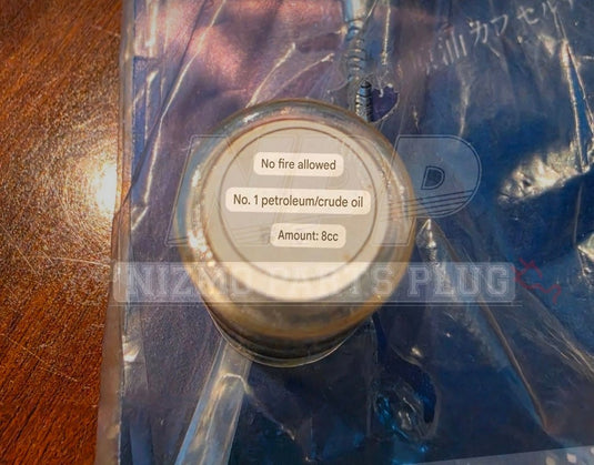 Vintage 70s Showa-Era Nissan Prince "Crude Oil Capsule" Promotional Keychain (UAE / Resource Conservation) - NizmoPartsPlug