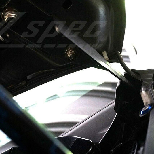 ZSPEC stainless and blue billet fastener kit installed on a '17-'20 Infiniti Q50/Q60 engine bay hinge.