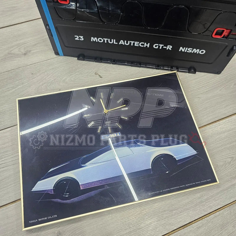 Cargue la imagen en el visor de la galería, Collectible Nissan AD-1 Concept wall clock in a gold frame, featuring a white concept car illustration on black.
