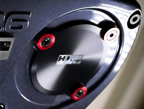 Load image into Gallery viewer, CRANK ANGLE SENSOR CONVERSION KIT RB26DETT FOR V CAM SYSTEM close-up showing black plate with red accents.
