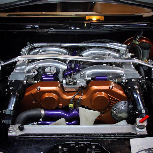 ZSPEC stainless fastener kit installed on a Nissan 300ZX Z32 engine with copper timing covers and purple accents.