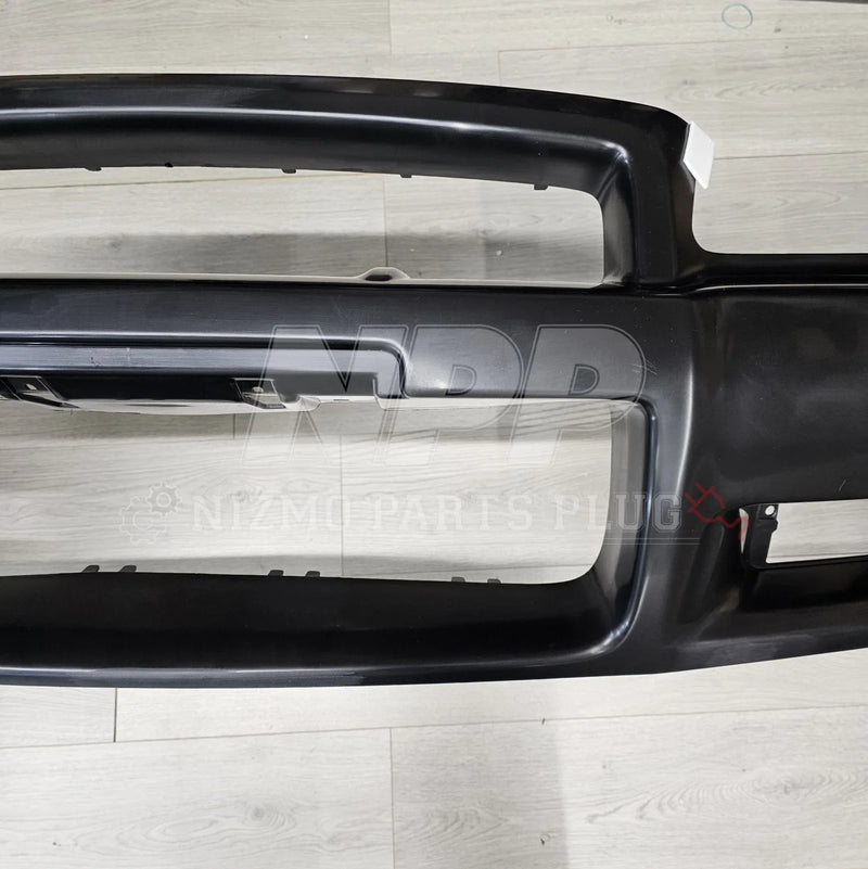 Load image into Gallery viewer, Nissan R34 Skyline GT-R Standard Front Bumper Assembly - NizmoPartsPlug
