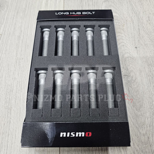 New Nismo silver 13x50mm front wheel studs for Nissan Skyline R32, R33, R34 in original foam packaging.