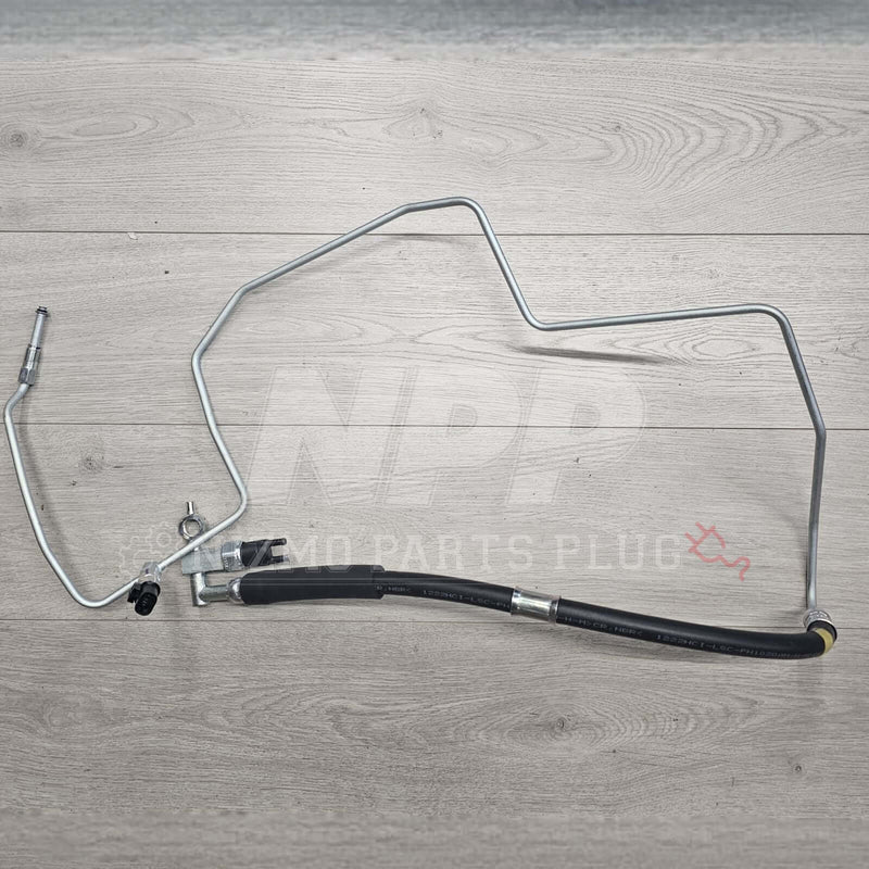 Load image into Gallery viewer, Nissan R34 Skyline power steering high-pressure hose and metal tube assembly in silver and black.
