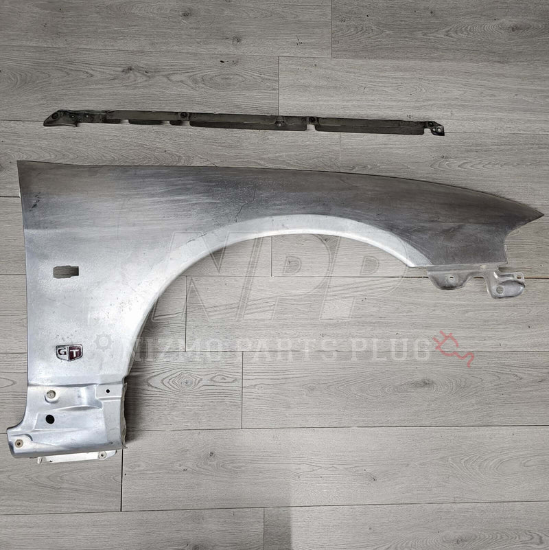 Load image into Gallery viewer, Nissan R33 Skyline GTR Fender &amp; Mounting Riser Set (Pre-Owned) - NizmoPartsPlug
