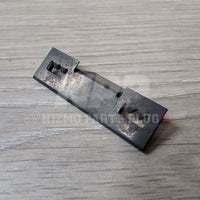 Nissan R32 Skyline GT-R Front Bumper Lower Grill Mounting Pressure Clip on a wooden surface