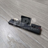 Nissan R32 Skyline GT-R Front Bumper Lower Grill Mounting Pressure Clip on a wooden surface.