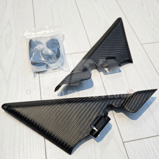 Muse Japan dry carbon inner mirror cover set for Nissan Skyline R34 with included hardware.