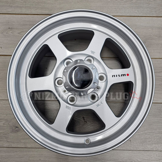 Nismo Frontier Rays Engineering TE37X Wheel Assembly 16x7 6 lug on wooden surface