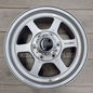 Nismo Frontier Rays Engineering TE37X Wheel Assembly 16x7 6 lug on wooden surface