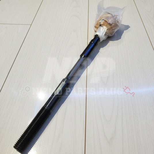 Black metal rod with a threaded end on a light wooden floor
