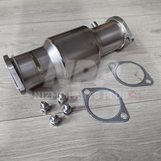 Shiny titanium high-flow catalyst for Nissan RB26DETT with included gaskets and mounting hardware on wooden background.