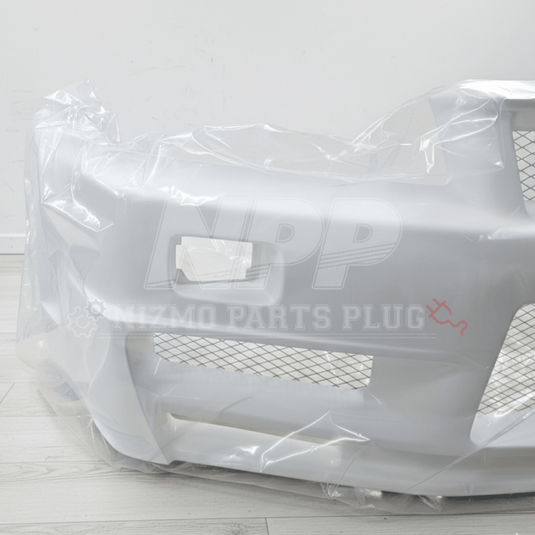 White Nissan R34 GTR Nismo Z-Tune front bumper assembly in protective plastic wrapping.