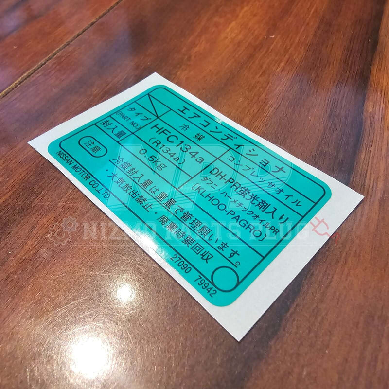 Load image into Gallery viewer, Nissan Skyline R33/34 GTR Air Conditioner Label Decal (Late Model) on wooden surface showing clear details of the product.
