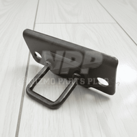 Black metal bracket on a light wooden surface with 'NPP Auto Parts' branding.