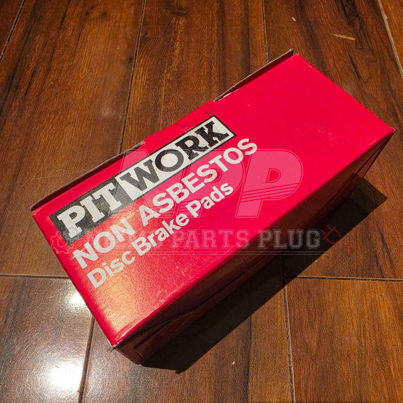 Load image into Gallery viewer, New Pit Work front brake pads for Nissan Stagea WC34 RS4-V in a red box on a wooden floor.
