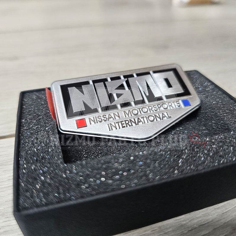 Load image into Gallery viewer, Nissan 40th Anniversary NISMO Old Logo Fender Emblem - NizmoPartsPlug
