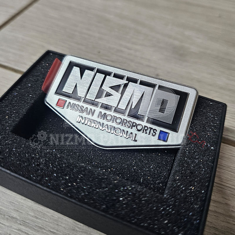 Load image into Gallery viewer, Nissan 40th Anniversary NISMO Old Logo Fender Emblem - NizmoPartsPlug
