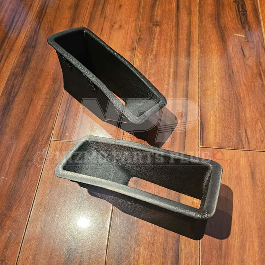 Mīrai Mamōru Reproduction R32 GTR N1 Style Front Air Duct (RH + LH Set) displayed on wooden surface.