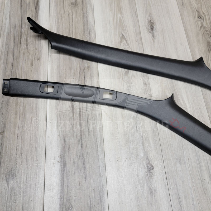 Load image into Gallery viewer, Black interior A-pillar garnish set for Nissan R34 Skyline Coupe. Clean, original condition.
