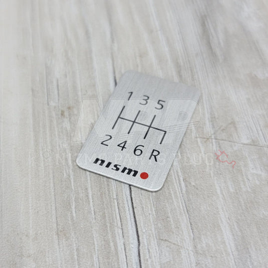 Nismo 6-Speed Manual Shift Pattern Brushed Emblem - NizmoPartsPlug