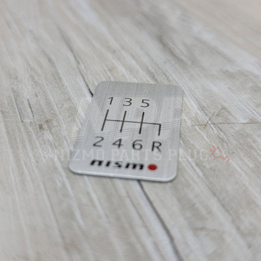 Nismo 6-Speed Manual Shift Pattern Brushed Emblem - NizmoPartsPlug