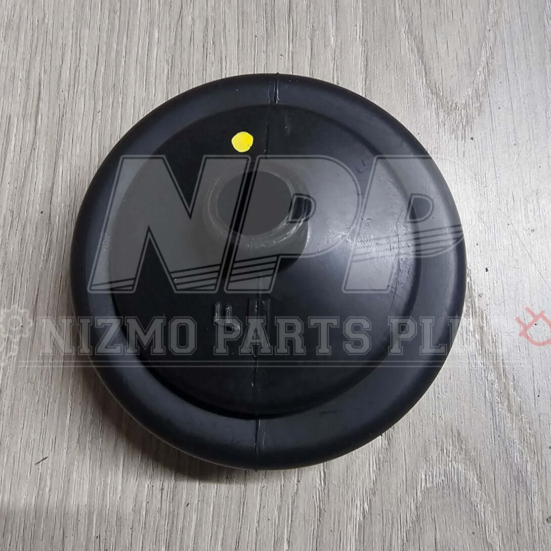 Nissan Genuine Control Lever Boot (Multiple Fitment) top view on a wooden surface.