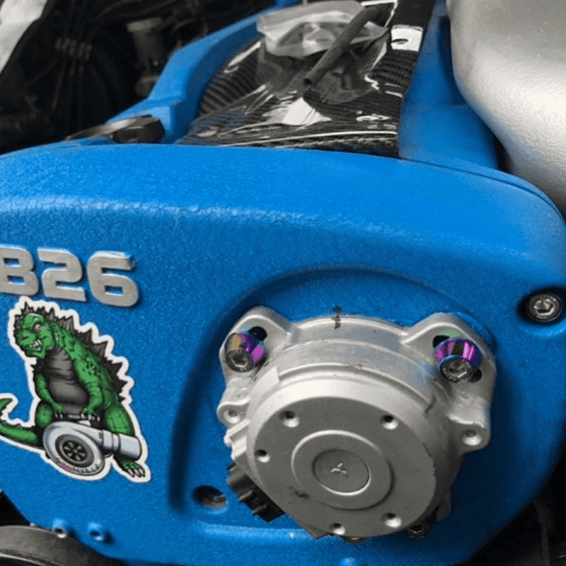Cargue la imagen en el visor de la galería, ZSPEC Stage-3 dress-up bolts installed on a Nissan RB26 engine cover (R32/R33/R34). Features colorful titanium finish.
