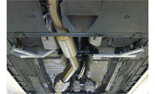 Nismo BNR34 GTR Center Floor Reinforcement Bar Assembly installed on vehicle underside for improved rigidity.