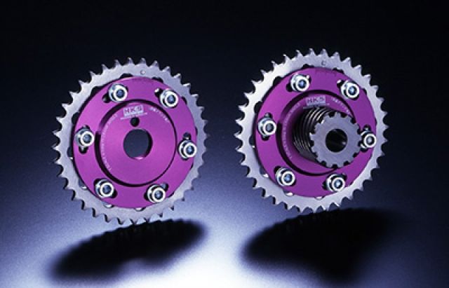 Load image into Gallery viewer, Purple HKS adjustable cam gears for Nissan PS13 SR20DET engine, shown from front and back.
