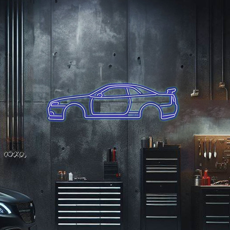 Load image into Gallery viewer, Blue neon metal wall art of a Skyline GT-R R34 side profile mounted on a dark industrial garage wall.
