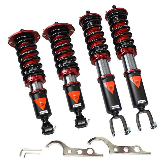 Godspeed coilovers for Nissan Skyline R32, featuring black and red springs, silver bodies, and adjustment wrenches.