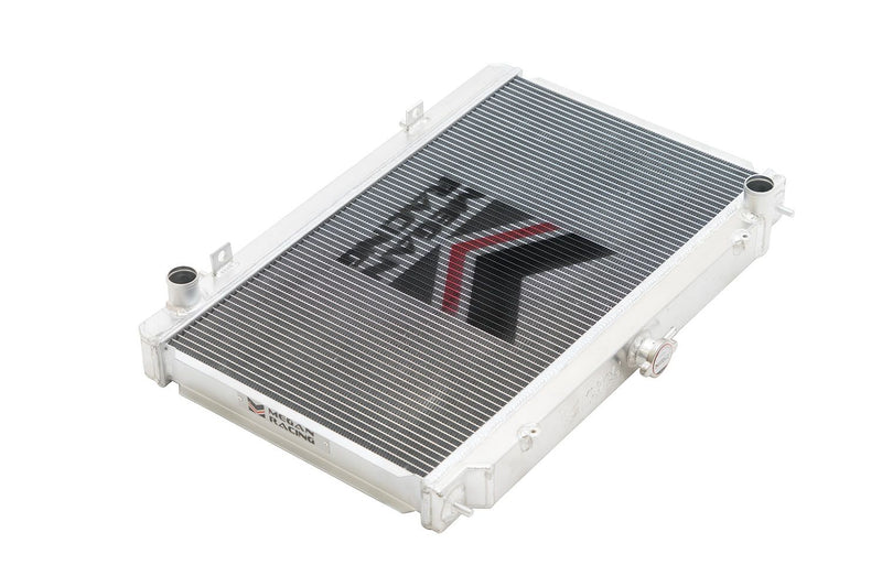 Load image into Gallery viewer, Megan Racing 3-row aluminum performance radiator for Nissan 240SX S14, silver finish with logo.
