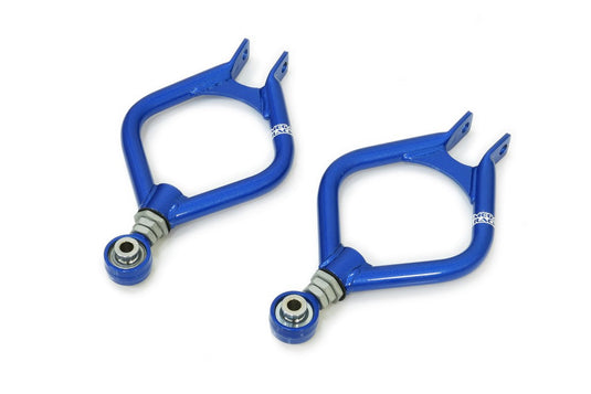 Blue Megan Racing rear adjustable camber kit for Nissan 240SX S13 with pillow ball joints.