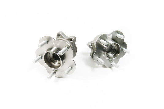 Megan Racing 4-to-5 lug conversion rear hub kit for Nissan S14. Pair of new, silver metallic wheel hubs.